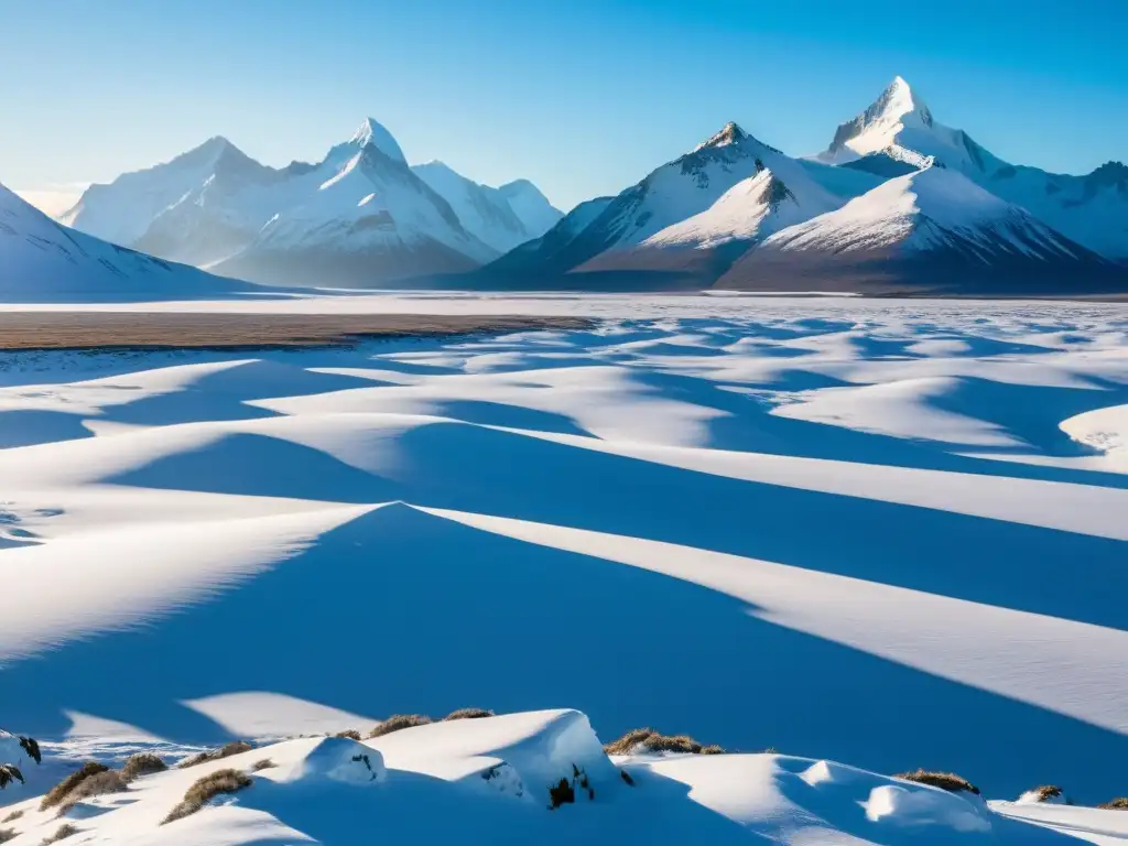 Imagen impresionante de la belleza austera de los ecosistemas polares, con tundra nevada, montañas heladas y majestuosos caribúes